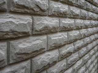 Abstract weathered texture stained old stucco light gray and aged paint white brick wall background in rural room, grungy rusty blocks of stonework technology color horizontal architecture wallpaper