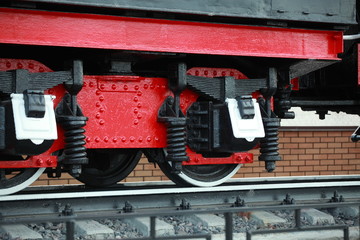 Obraz na płótnie Canvas The old wheels of the railway freight car on the rails. Pair of wheels.