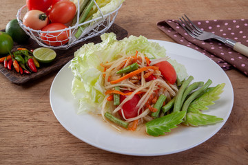 Thai papaya salad or Som Tum Isolated on the white background