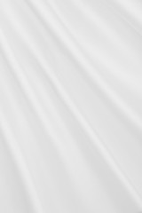 Smooth elegant white silk or satin luxury cloth texture as wedding background. Luxurious background design
