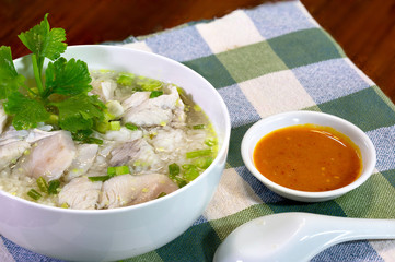 Boiled rice with sea bass in white bowl delicious food for thai breakfast