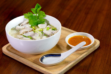 Boiled rice with sea bass in white bowl delicious food for thai breakfast.