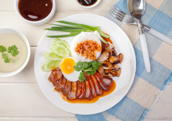 Barbecued red pork in sauce with rice, Chinese style roasted pork.