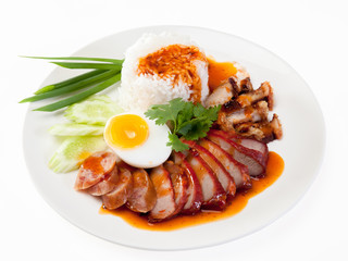 Barbecued red pork in sauce with rice, Chinese style roasted pork.