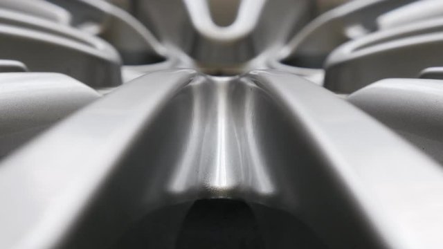Shallow DOF aluminium alloy wheel tilting footage