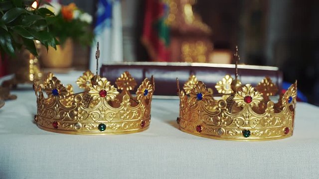 Gold crowns are on the altar. Attributes of priest