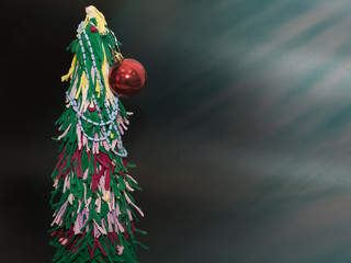 Christmas tree made of colored paper.Fur products.