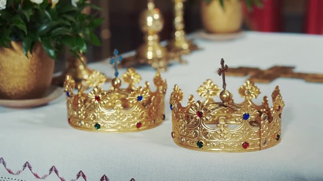 Church attributes for wedding ceremony. Gold crowns in church