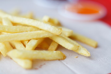 French fries on white background, unhealthy food concept