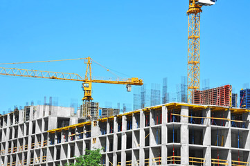 Crane and highrise construction site