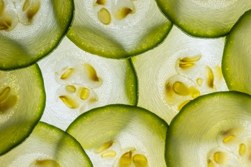 slices of zucchini on a white background