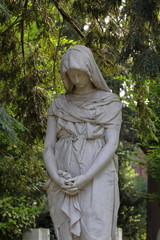 Graveyard sculpture of mourning woman with towel