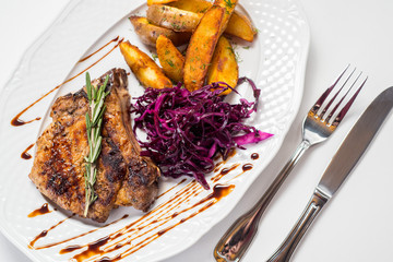 Grilled meat steak with fried potatoes and beet on white background