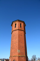 old abandoned red bricks train station tower