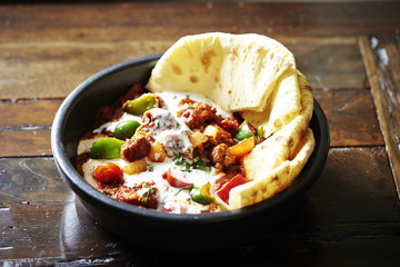 Tortilla with chili pork and sour cream sauce 