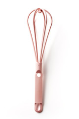 Pink kitchen whisk isolated on white, from above