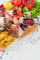 Grilled sausage dish with vegetable garnish. Top view