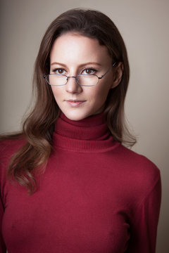 Woman Wearing Glasses In Red Sweaterb Turtle Neck