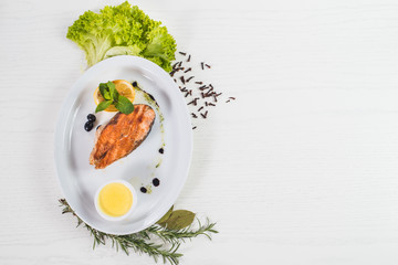 Fried salmon steak with lemon sauce