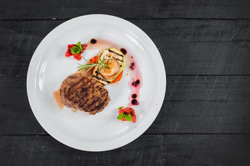 Grilled meat steak dish with fruits garnish