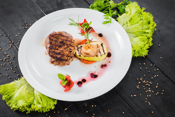 Grilled meat steak dish with fruits garnish
