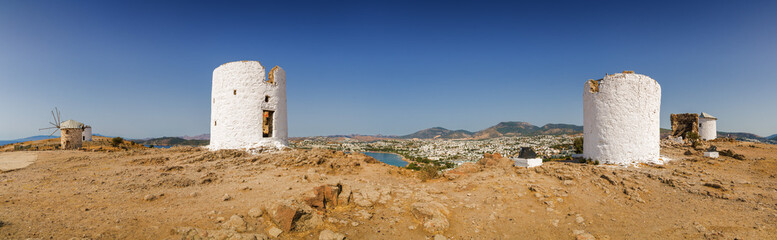 Sunny view of oldfashioned windmills at the hill of Bodrum, Mugla province, Turkey.