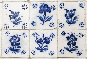 Ornamental old typical tiles from Portugal called azulejos made with colored ceramic tiles