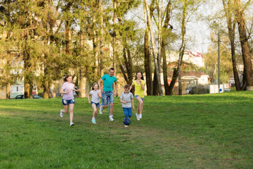 Family playing football on the field. Family football