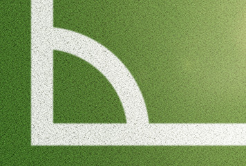 top view of corner arc on grass soccer field background