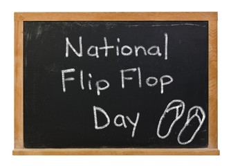 National Flip Flop Day written in white chalk on a black chalkboard isolated on white