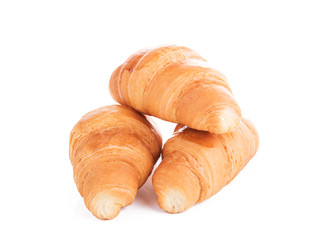 Three fresh croissants isolated on white background