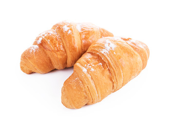Two croissants on a white background.