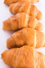 Fresh croissants isolated over white background
