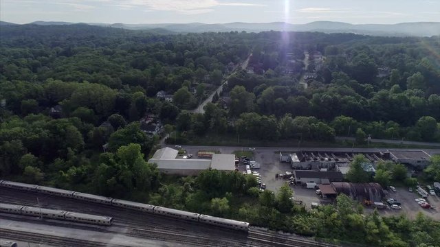 View of  Brewster New York,  Moving Train in Seen From a Distance  