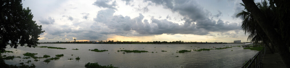 Obraz na płótnie Canvas panorama big river sunset with nimbus.