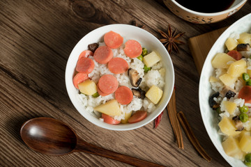 Wooden background and cooked rice