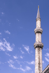Fototapeta na wymiar Mosque, minarets against a clear blue sky on a sunny day