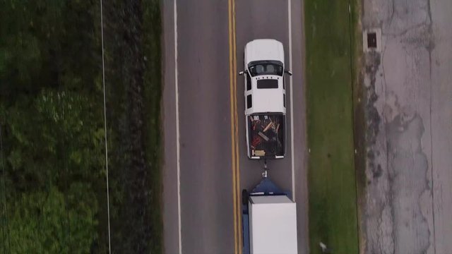 Top Down of a  Pick Up Truck with Cargo Trailer Driving in Brewster