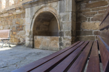 Benches in the courtyard of the fortress close up, selective focus