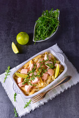 Salmon with penne noodle and arugula