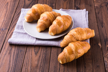 Freshly baked butter croissant. Closeup