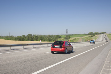 Cars are driving fast on the highway