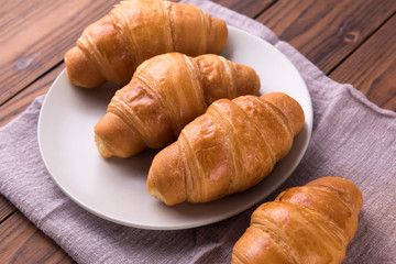 Freshly baked butter croissant. Closeup