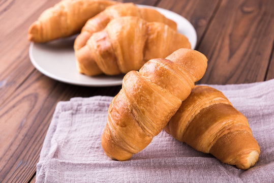 Freshly baked butter croissant. Closeup