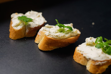 piece of sandwich baguette cereal black background