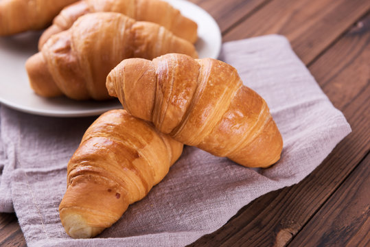 Freshly baked butter croissant. Closeup