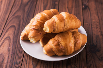 Freshly baked butter croissant. Closeup