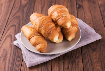 Freshly baked butter croissant. Closeup