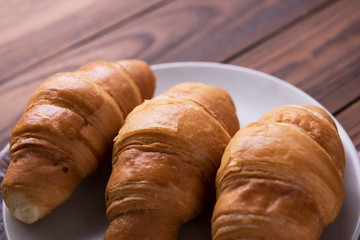 Freshly baked butter croissant. Closeup