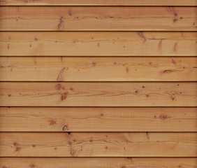 Wall of new wooden plank boards. Wooden material texture surface.